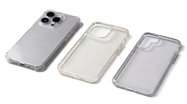 three clear protective phone cases, including two for iphones and one for a smaller device, are laid out on a white background with a phone in a case.