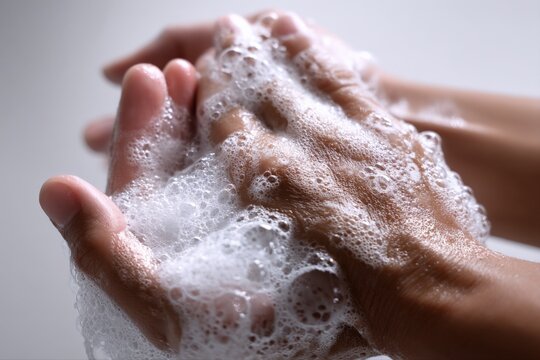 Hand Washing Hygiene: Close-up of Hands Covered in Soap Suds for Thorough Cleaning