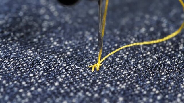 Close-up of sewing denim fabric.