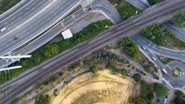 Aerial drone view of Turcot Interchange, Lachine Canal and baseball field at dusk in Montreal, Quebec, Canada. g.