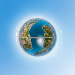 Fototapeta premium Istanbul, Turkey. Fatih Sultan Mehmet Bridge is a suspension bridge across the Bosphorus Strait, between Europe and Asia. Summer sunny day. 360 degree aerial panoramic asteroid