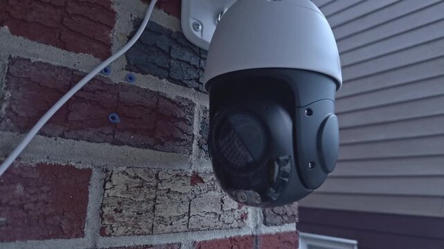 Outdoor Dome Surveillance Security Camera with Mount on Brick Facade