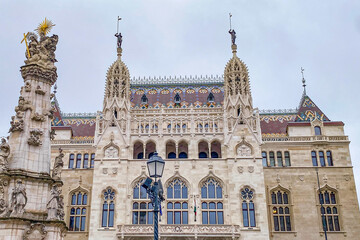 Fototapeta premium Mathias church or the Church of Our Lady of Buda Castle and its tower, fisherman's bastion in Castle hill and district on a beautiful winter Christmas season day, Budapest, Hungary 