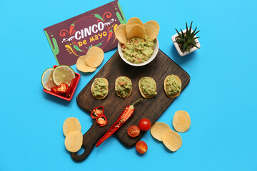 Traditional Mexican food and Cinco de Mayo greeting card on blue background