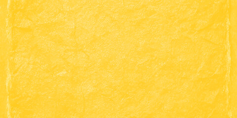 Obraz premium vibrant yellow textured paper background with weathered edges and rough fiber grain for artistic design backdrop