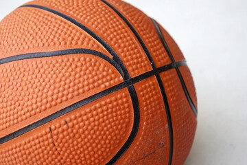 Fototapeta premium Orange basketball with textured surface and black lines