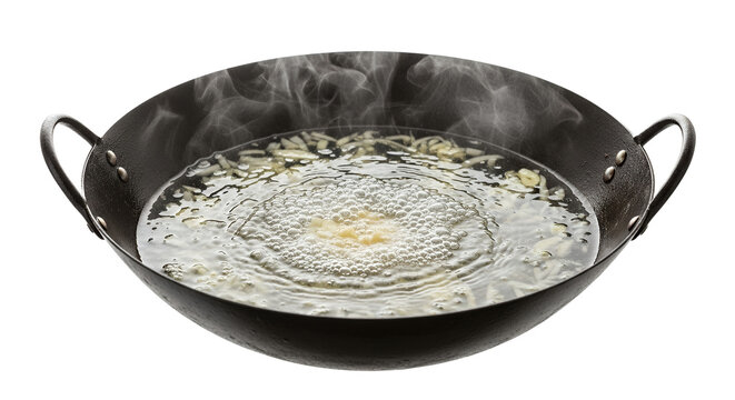 Dynamic boiling liquid with various ingredients inside a dark metal wok generating copious visible steam against a pristine pure white background,