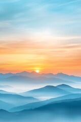 Obraz premium Serene Sunrise Over Misty Mountains with Soft Blue and Orange Hues in the Sky