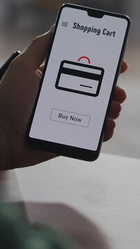 Close-up of a person using a smartphone shopping cart app, viewing items with notifications and confirming a successful online order with instant purchase button