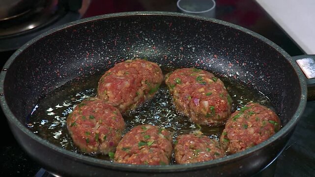 Sizzling Arabian Lamb Koftas Frying to Golden Perfection for an Authentic Middle Eastern Feast