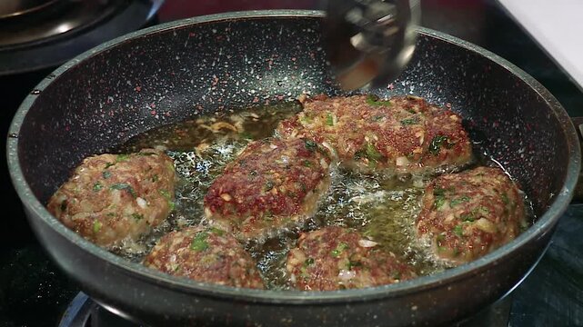 Sizzling Arabian Lamb Koftas Frying to Juicy Golden Perfection