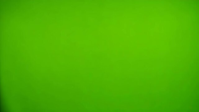 Red Gift Wrap Tearing Away to Reveal Vibrant Green Screen
