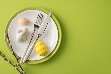 Happy Easter table setting featuring a striped yellow egg, speckled egg, ceramic bunny figurine,...