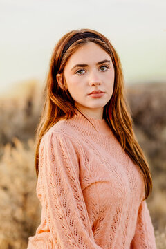 Young woman outdoors in warm sunset light