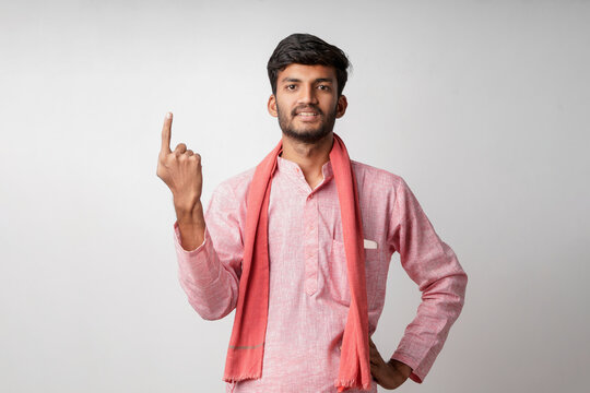 Indian farmer showing voting sign after vote on white background
