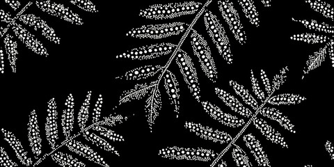 Stylized fern leaves create a repeating black and white pattern © Tapan