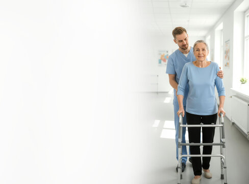 Young physiotherapist supports elderly woman with walker in a bright hallway of a rehabilitation center, horizontal banner with place for text. AI generative