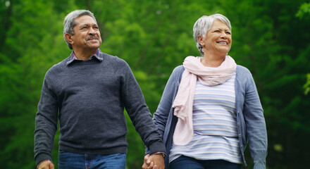Love, smile or old couple in park with holding hands, healthy relationship or bonding on weekend break. Space, senior man or woman outdoor with care, connection or romantic moment on retirement date.