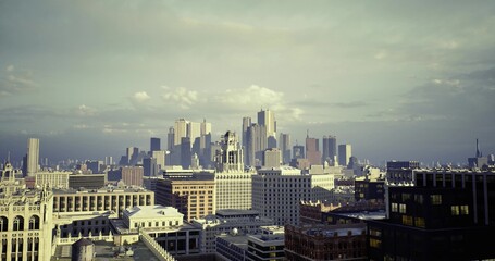 Obraz premium dense urban skyline under moody overcast sky, planner perspective capturing heavy cloud bank and distant towers, textured rooftops and gridlike streets