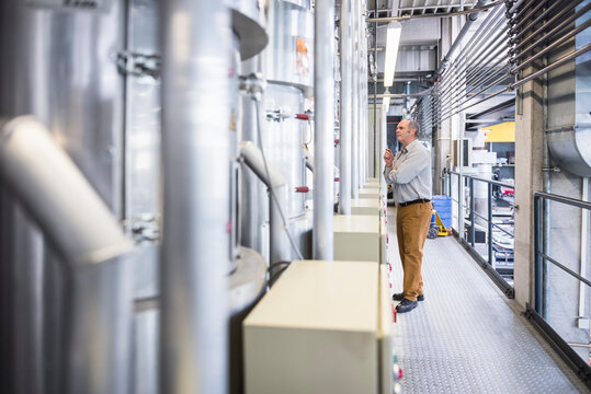 Man examining the system in factory