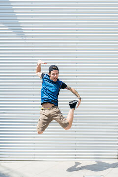 Young man jumping in the air