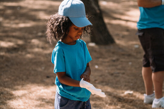 Little girl preparing to clean the forest