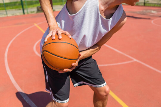 Young man playing basketball