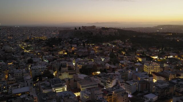 Panoramic drone shot of the Acropolis and Parthenon during dusk in Athens, Greece