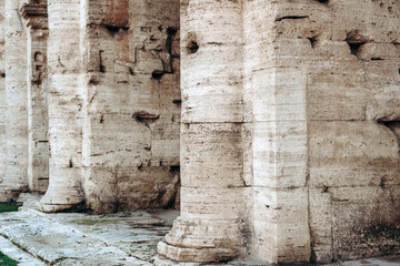 Columns support a structure in an ancient site during daylight hours in a historical location