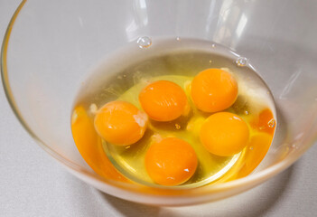 Fresh Eggs in Glass Bowl on Kitchen Countertop