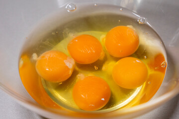 Fresh Eggs in Glass Bowl on Kitchen Countertop