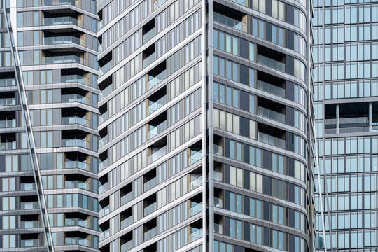 Daylight pattern of modern glass windows on architecture facade in Frankfurt Germany finance district creating a crisp corporate design texture