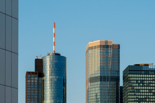 Modern glass skyscraper tower architecture in Frankfurt Germany finance skyline in clear daylight creating a clean corporate city landmark
