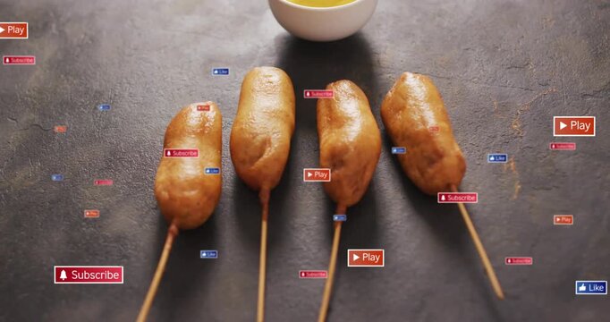 4 corn dogs staying on tabletop on play, subscribe or play badges clustering then fading for ads