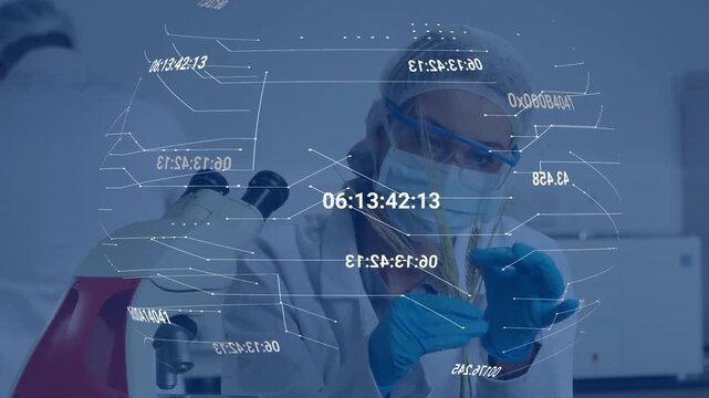 Female lab tech lifting vial, aligning sample to test while holo graphs floating over hands