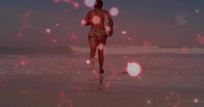 Male surfer spotting swell running to breaks surfing holding greenwhite board red overlaying frames