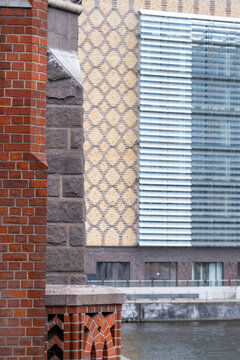Abstract modern architecture facade blending texture pattern brick and glass with details and contrast shaping urban design lines in a contemporary exterior close up