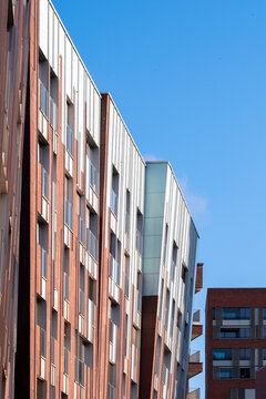 Abstract modern architecture building facade with urban pattern windows and color lines showcasing contemporary design in a bold geometric exterior view