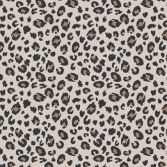 Seamless Chic Leopard Print Pattern with Black and Brown Spots on Nude Background © Elymand