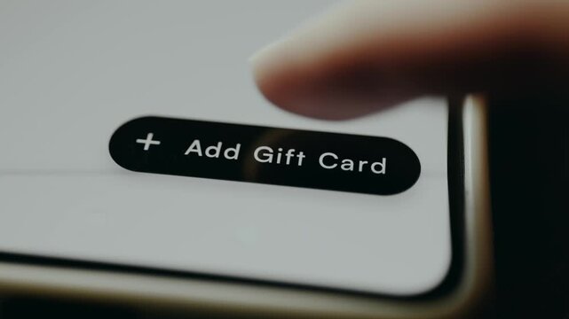 Person presses the button labeled Add Gift Card