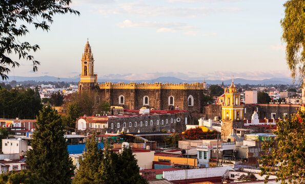 Aerial view over the Parroquia de San Andres Apostol and the downtown of Cholula, Puebla, Mexico