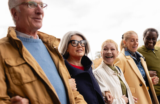 A diverse group of active seniors enjoying time together outdoors