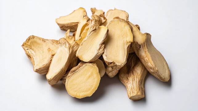 Dried tongkat ali root slices isolated on white background. Herbal supplement concept representing traditional medicine, energy boosting and natural health ingredient.