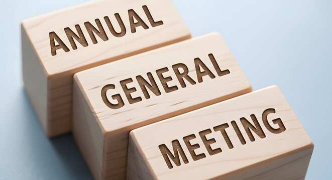 Annual General Meeting Concept on Wooden Blocks