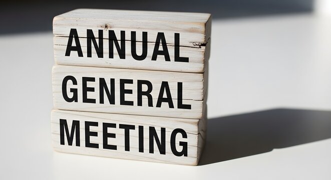 Annual General Meeting Concept on Wooden Blocks