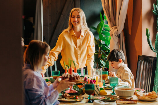 Family celebrating Easter dinner together at home