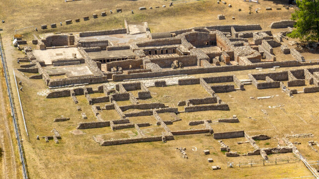 Aerial perspective of an Ancient Roman city, in an archaeological site featuring stone foundation ruins. Panorama of the archaeological park at Venosa, in province of Potenza, Basilicata, Italy.
