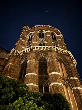 Gothic Venetian Church Illuminated at Night with Stars in Dark Blue Sky, Venice Italy Architecture