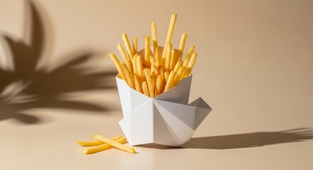 French fries in geometric paper container with dramatic shadow on beige background

