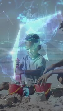 Child pressing shovel and parent guiding, making castles with AR globe wrapping scene showing tech